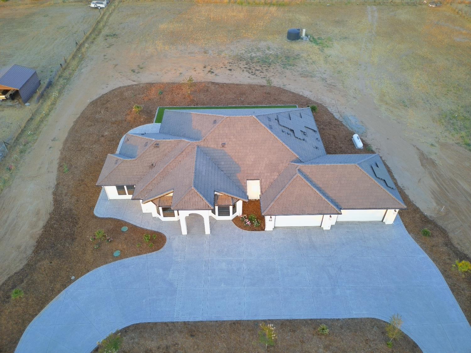 21275 Road 28 1/2 Madera, CA 93638 - Photo 7 of 28 an aerial view of a house with a yard