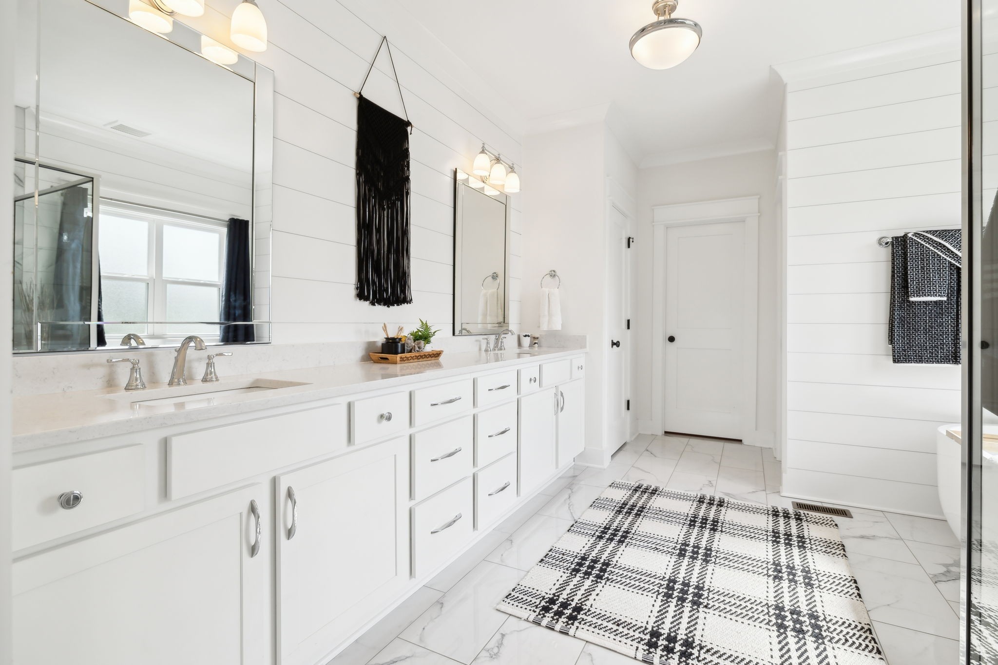 11769 Milton Street Milton, TN 37118 - Photo 27 of 77 a bathroom with a double vanity sink a mirror and a shower