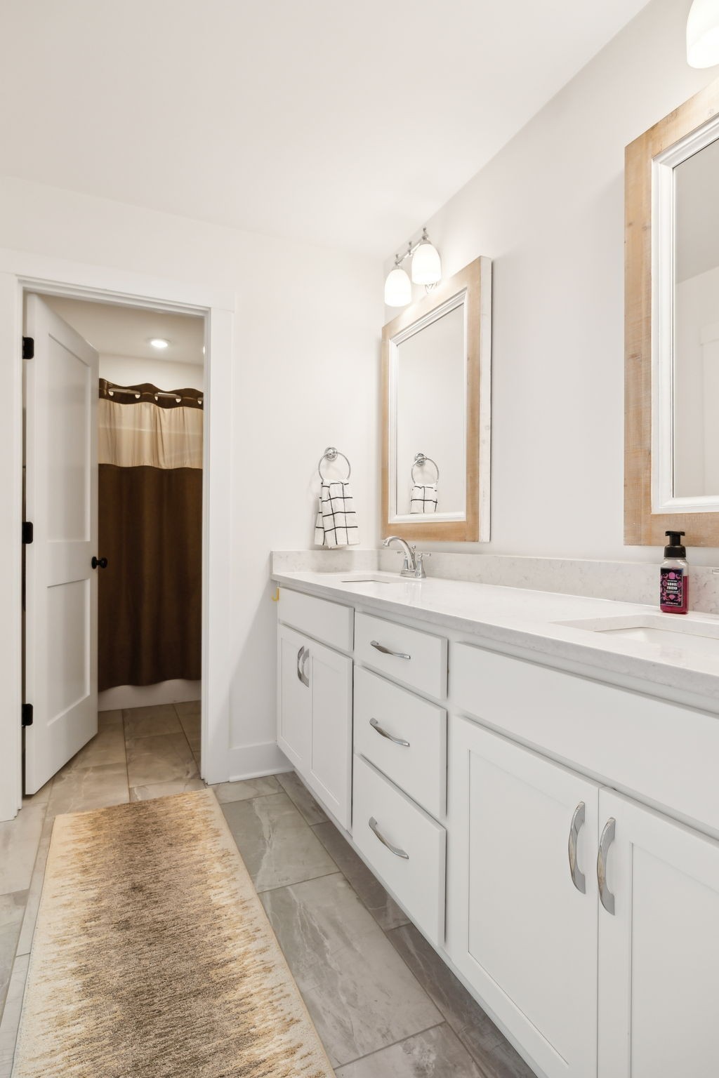 11769 Milton Street Milton, TN 37118 - Photo 46 of 77 a spacious bathroom with a shower sink and mirror