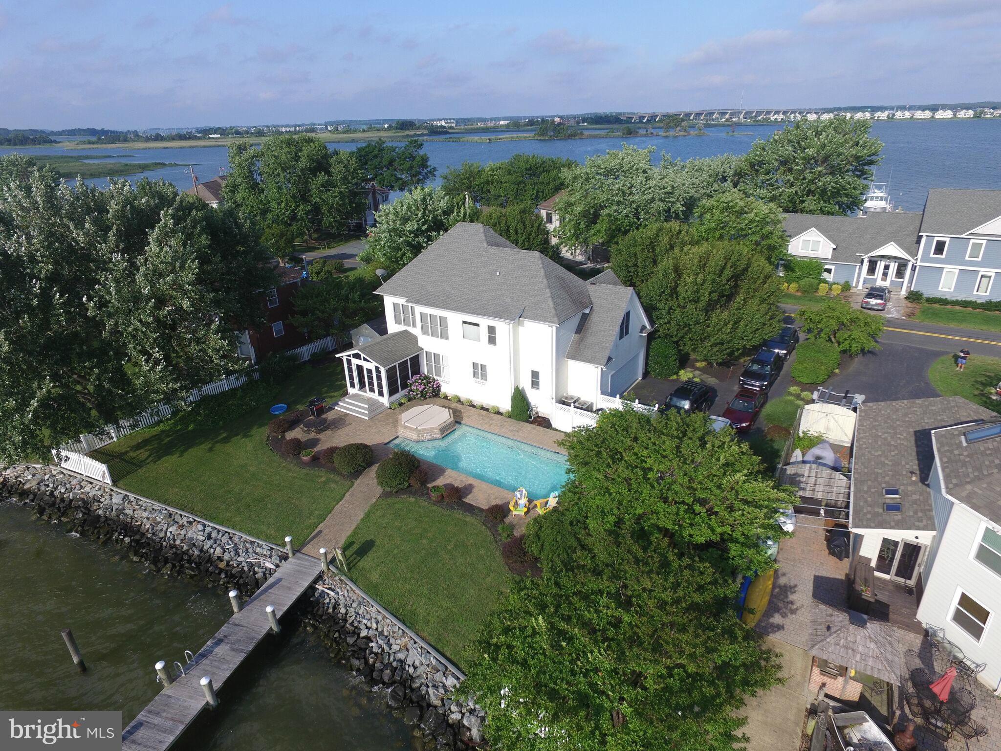 1014 Long Point Road Grasonville, MD 21638 - Photo 2 of 16 an aerial view of a house with a garden and lake view