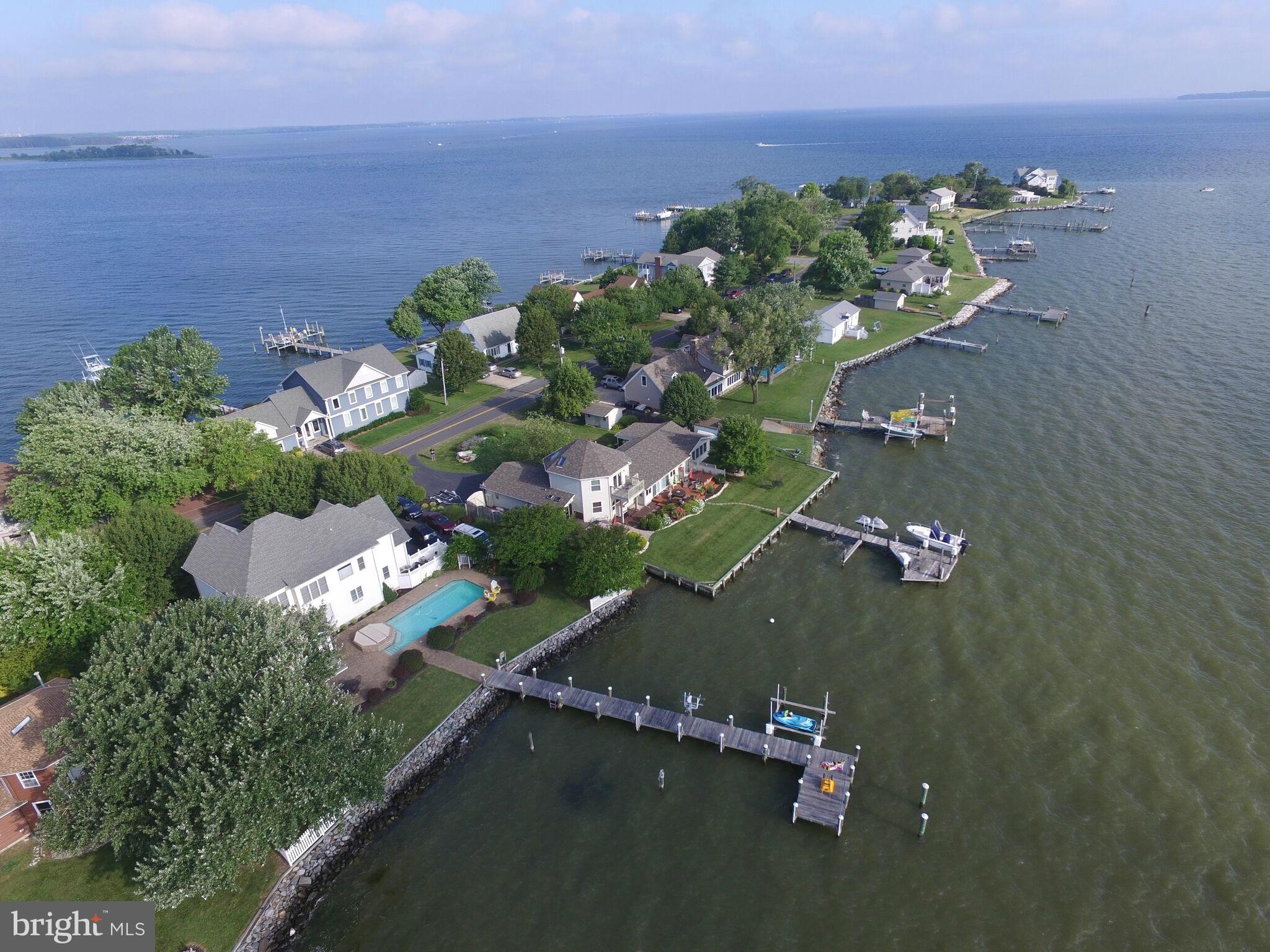 1014 Long Point Road Grasonville, MD 21638 - Photo 3 of 16 an aerial view of a house with a yard and lake view