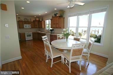 1014 Long Point Road Grasonville, MD 21638 - Photo 10 of 16 a view of a dining room with furniture and wooden floor