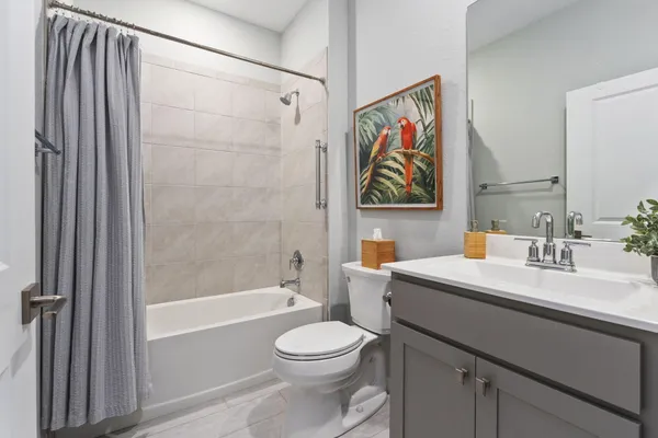 a bedroom with bed and window