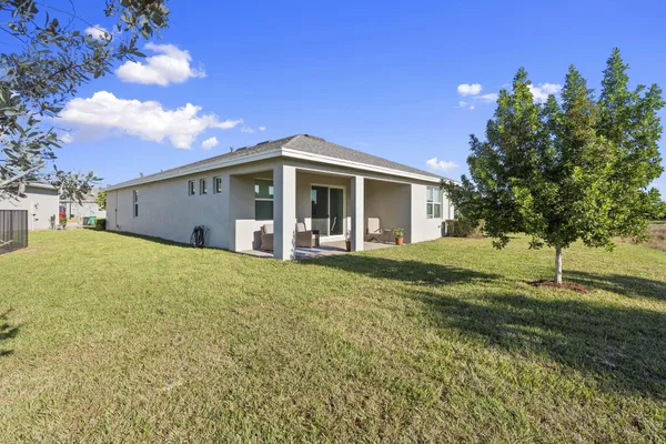 a view of a backyard of the house