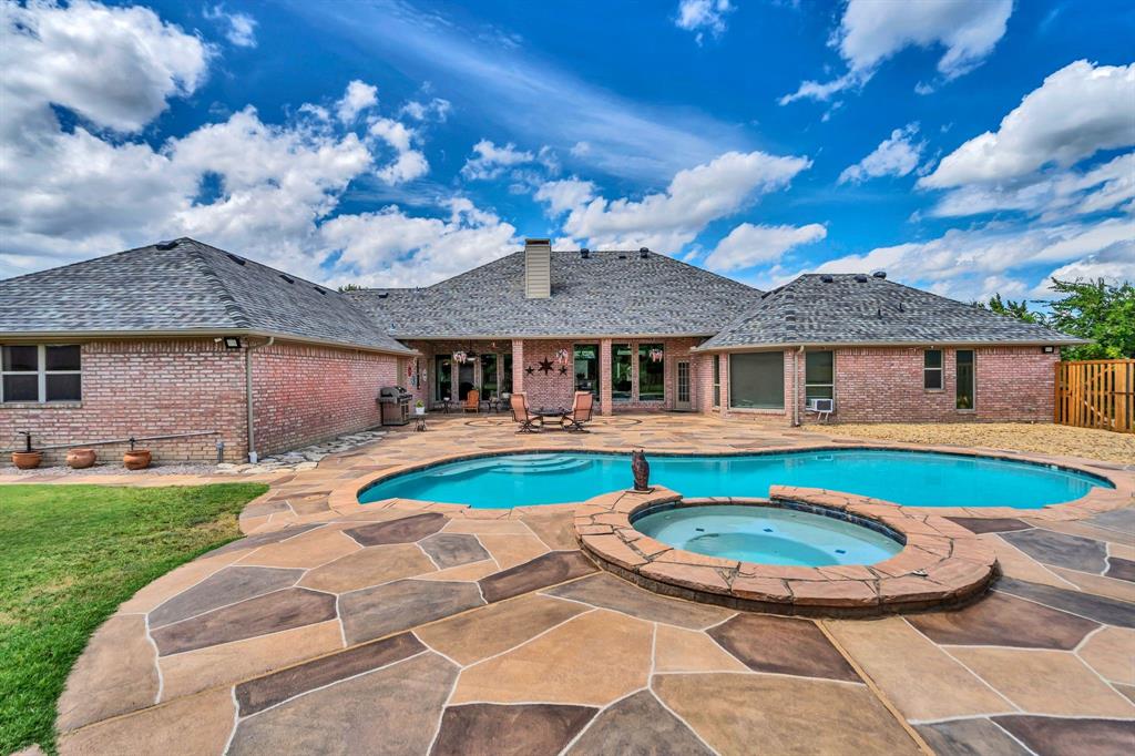 50 Buckingham Lane Allen, TX 75002 - Photo 38 of 39 View of pool with a patio area, a pool with connected hot tub, and grilling area