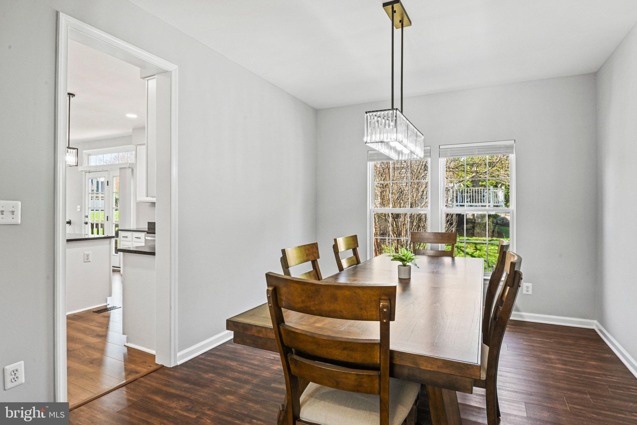 20733 Rainsboro Drive Ashburn, VA 20147 - Photo 18 of 63 a view of a dining room with furniture window and wooden floor