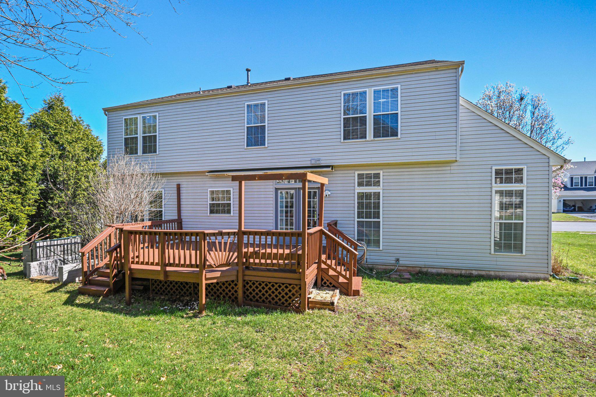 20733 Rainsboro Drive Ashburn, VA 20147 - Photo 24 of 63 a view of a house with a yard and sitting area