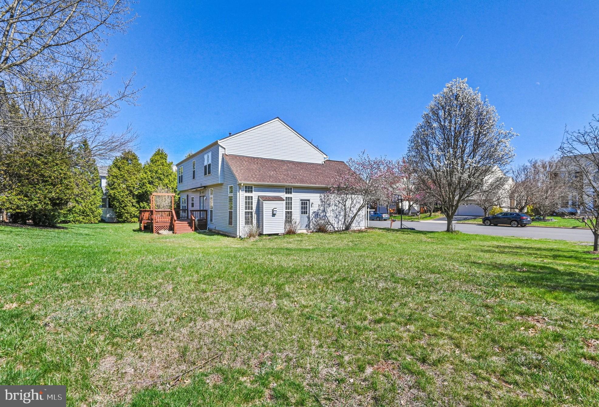 20733 Rainsboro Drive Ashburn, VA 20147 - Photo 3 of 63 a view of a house with a big yard and large trees
