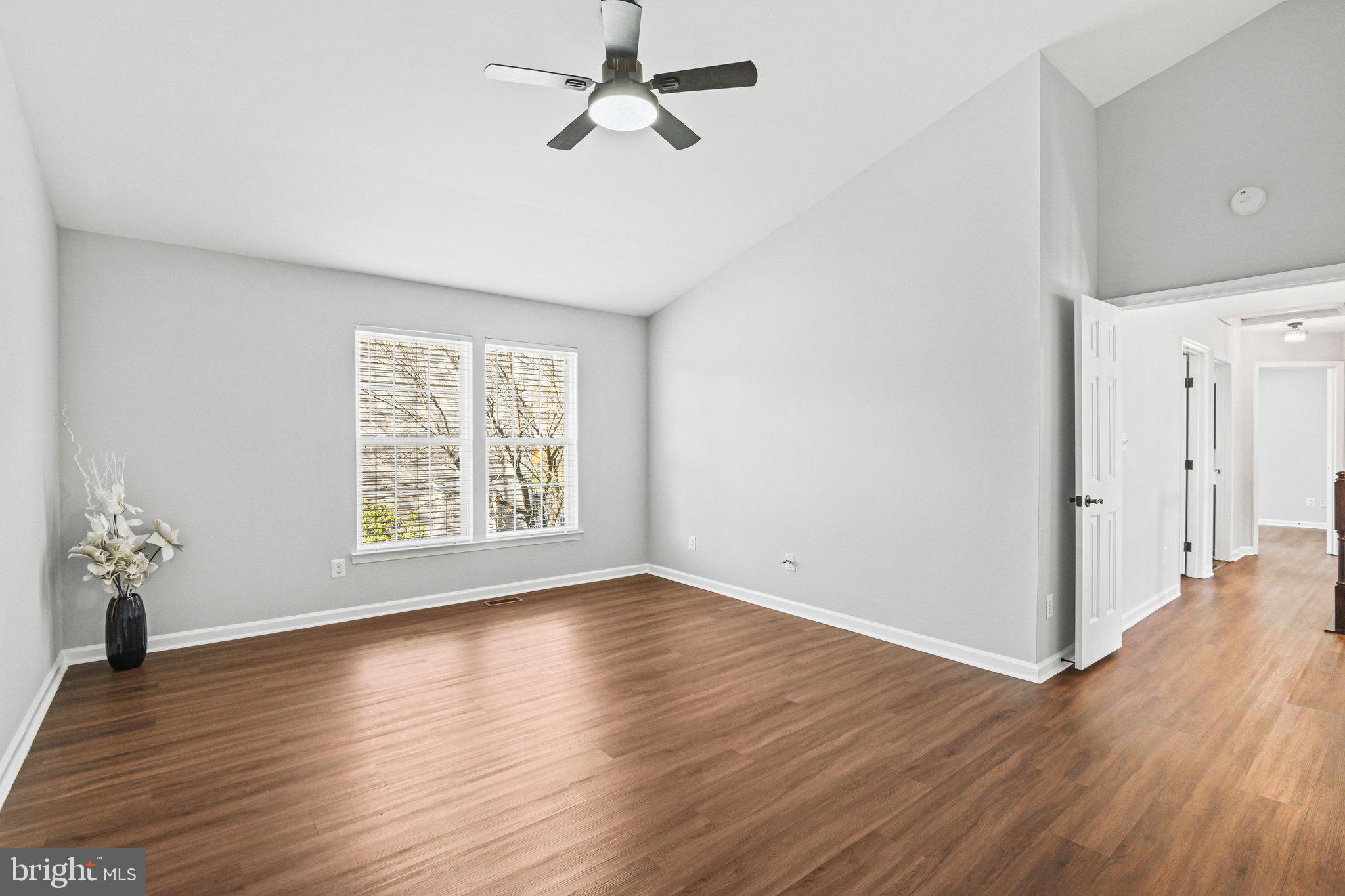 20733 Rainsboro Drive Ashburn, VA 20147 - Photo 31 of 63 a view of an empty room with wooden floor and a window