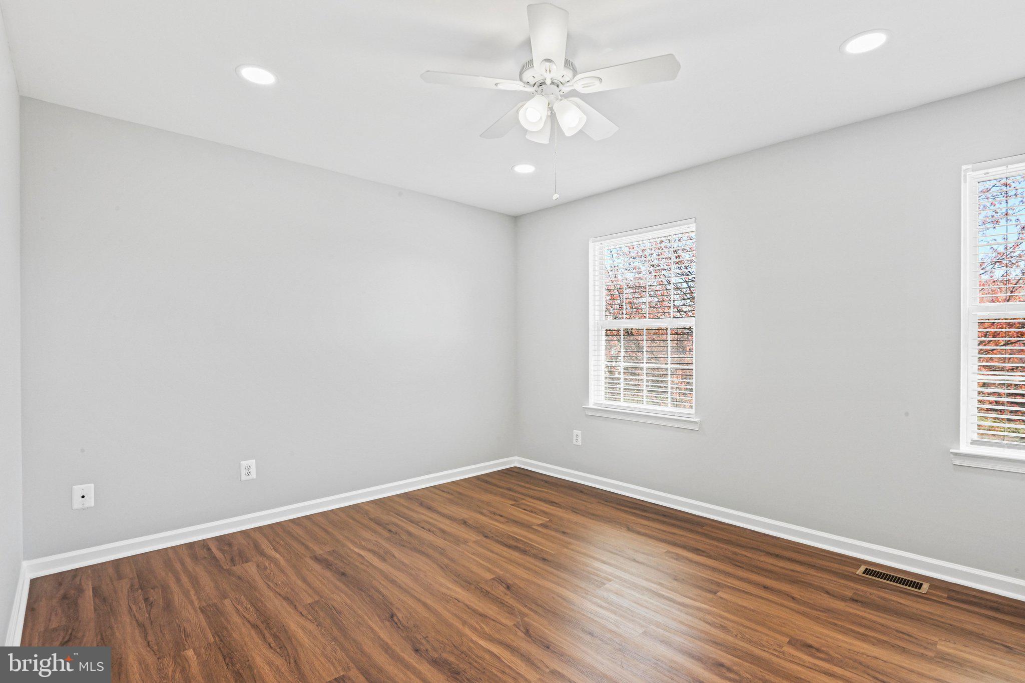 20733 Rainsboro Drive Ashburn, VA 20147 - Photo 38 of 63 wooden floor in an empty room with a window