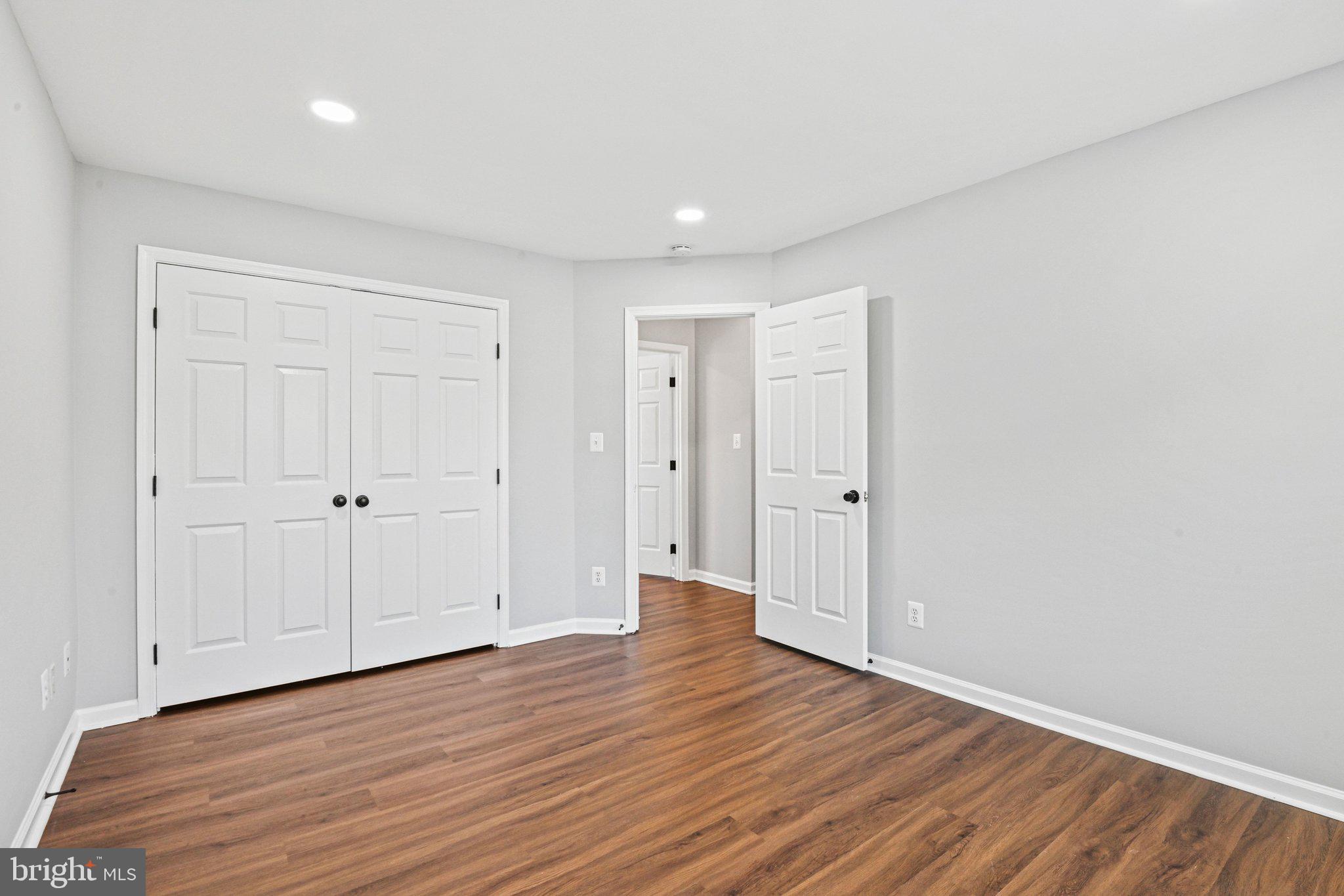 20733 Rainsboro Drive Ashburn, VA 20147 - Photo 41 of 63 a view of an empty room with wooden floor