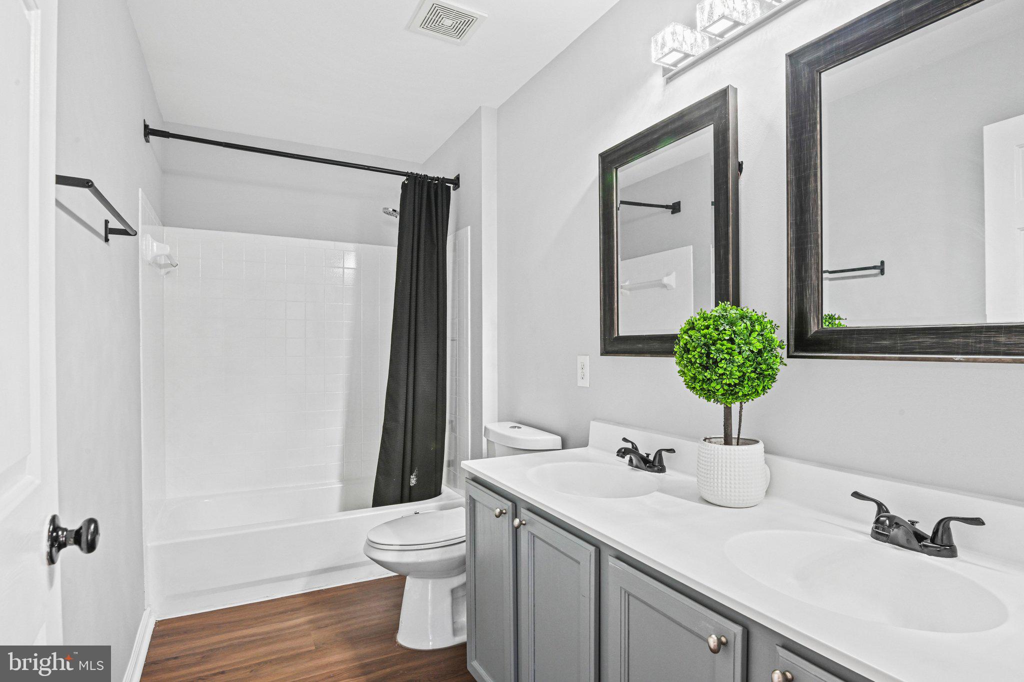 20733 Rainsboro Drive Ashburn, VA 20147 - Photo 42 of 63 a bathroom with a sink toilet and shower