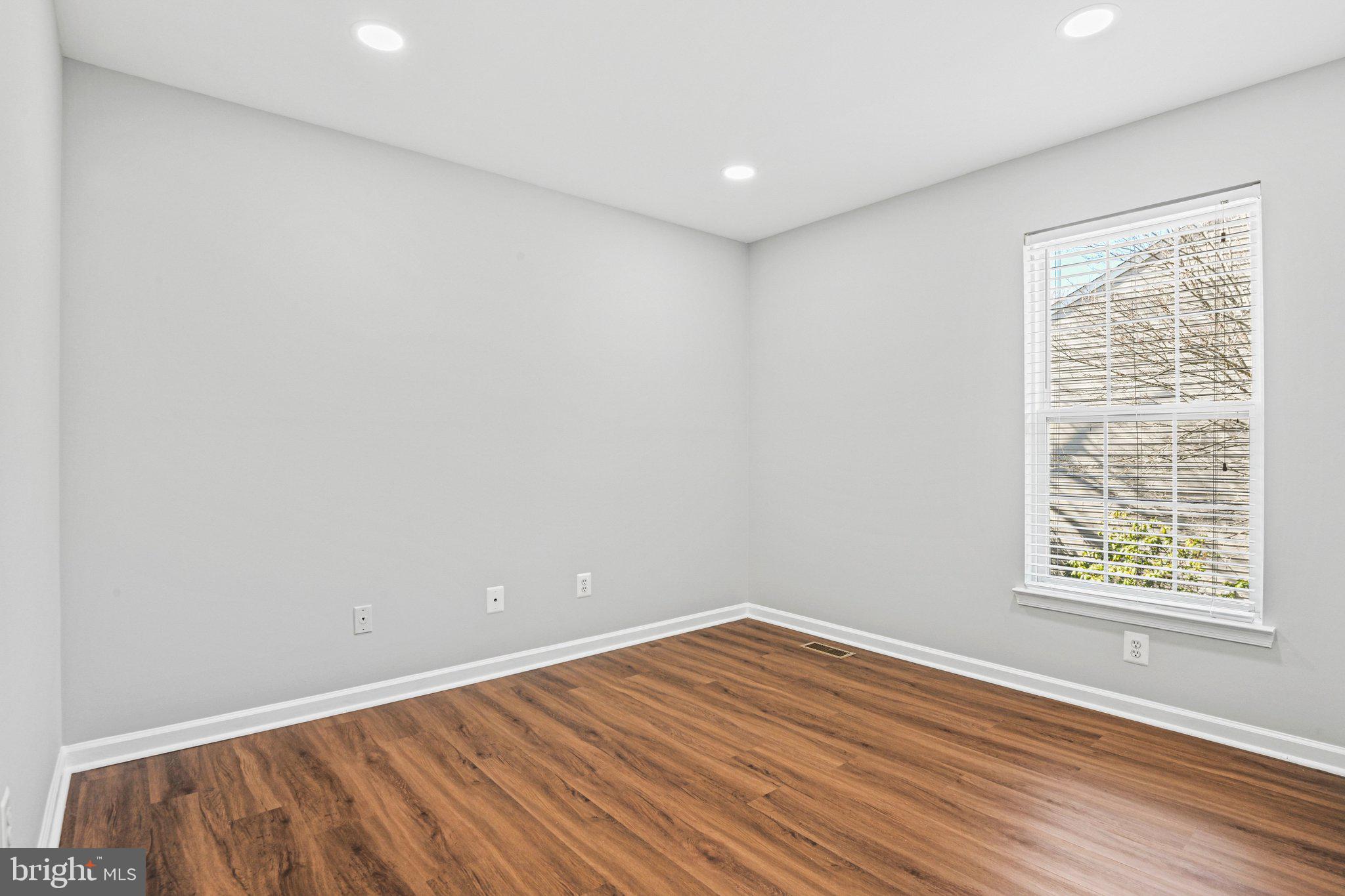 20733 Rainsboro Drive Ashburn, VA 20147 - Photo 44 of 63 wooden floor in an empty room with a window