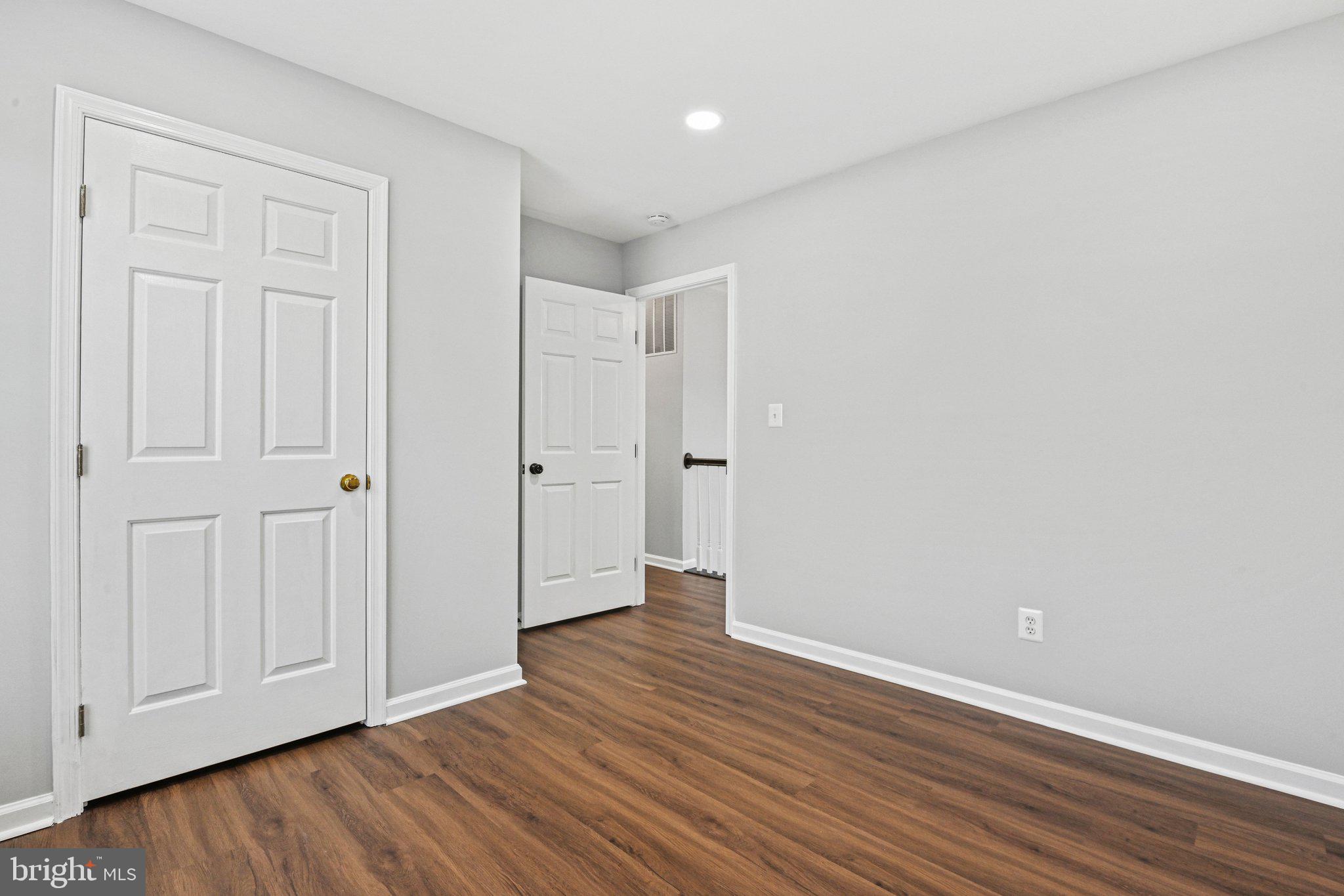 20733 Rainsboro Drive Ashburn, VA 20147 - Photo 45 of 63 a view of an empty room with wooden floor