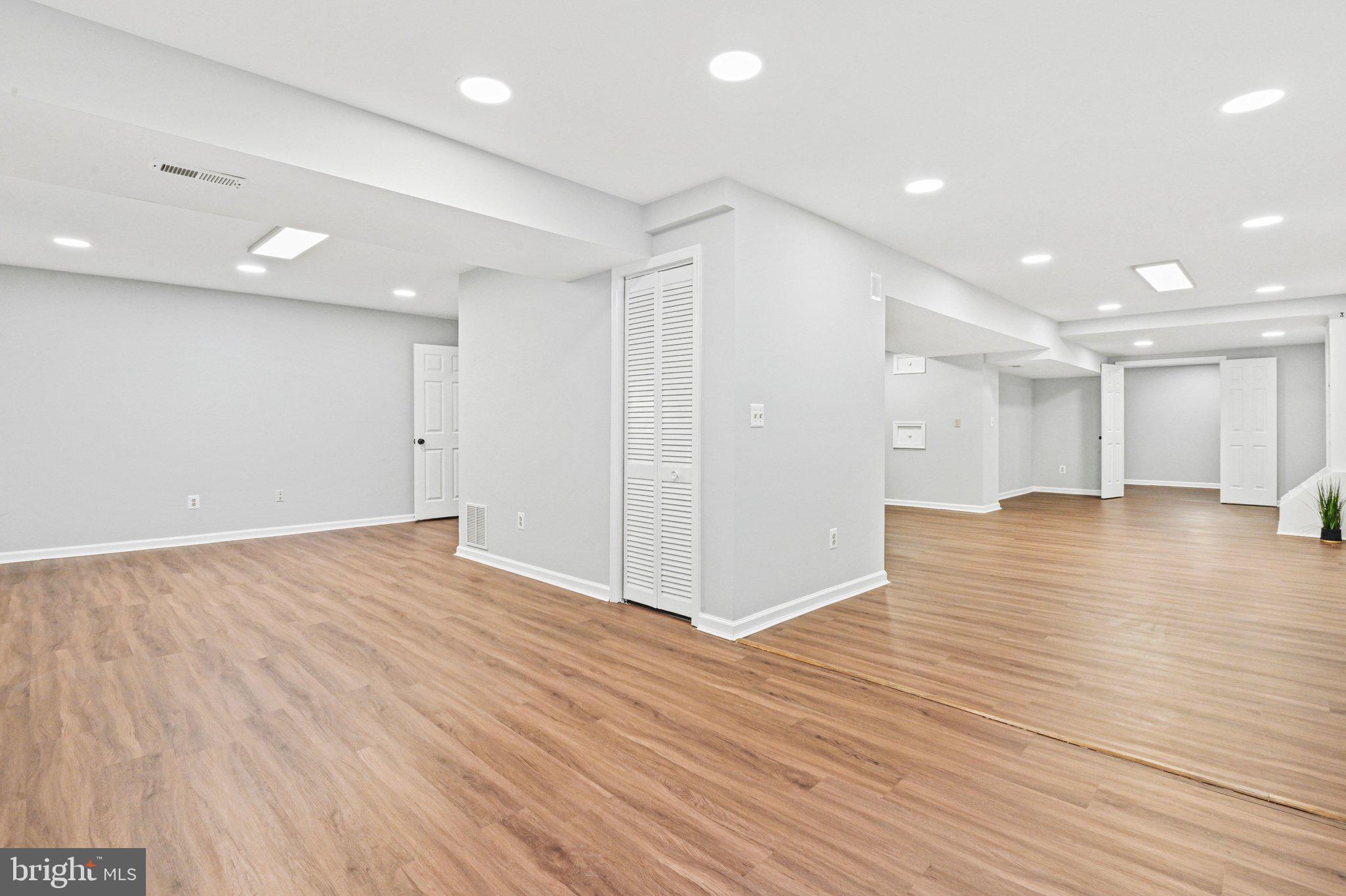 20733 Rainsboro Drive Ashburn, VA 20147 - Photo 46 of 63 a view of an empty room with wooden floor
