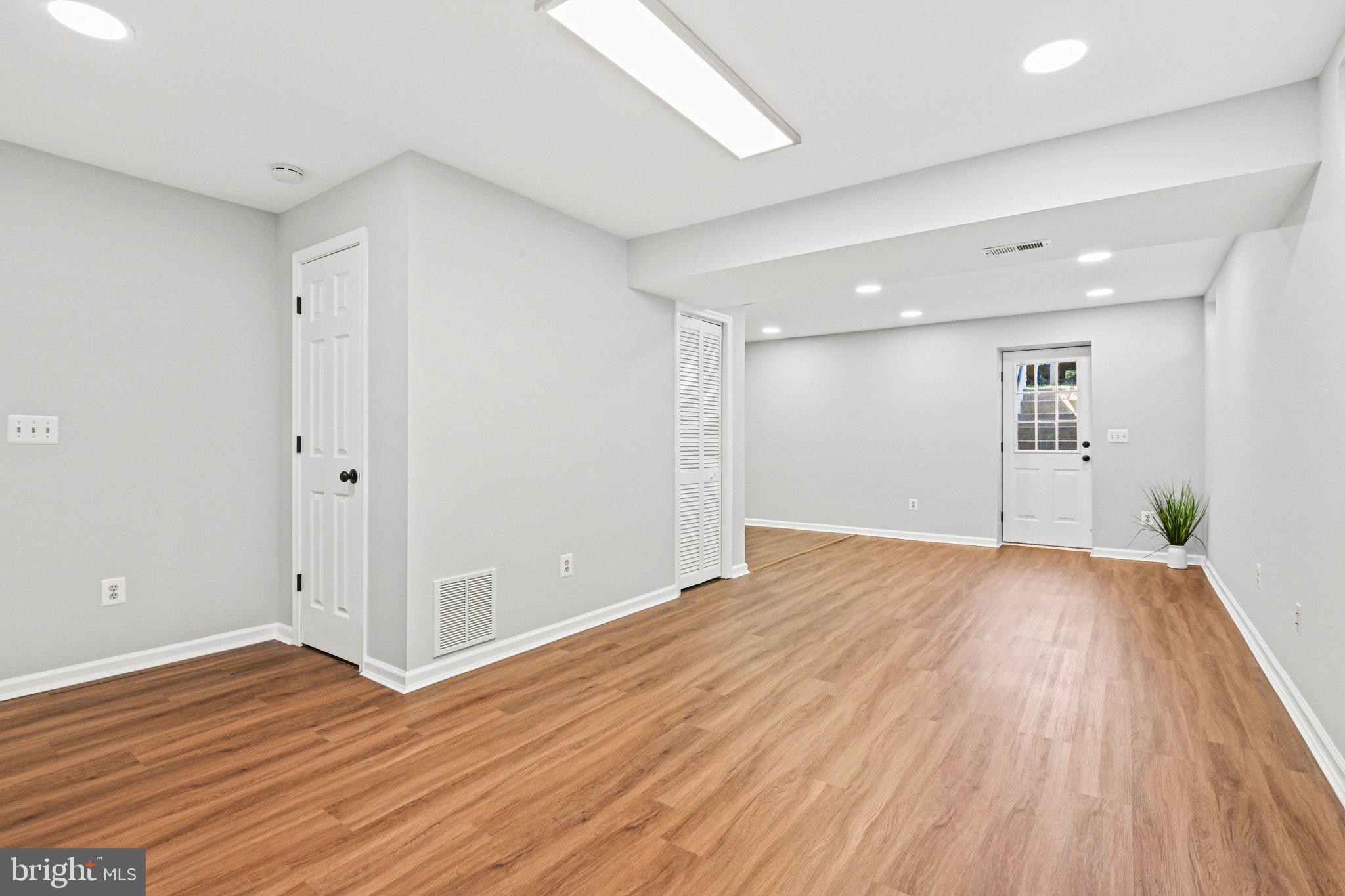 20733 Rainsboro Drive Ashburn, VA 20147 - Photo 47 of 63 a view of empty room with wooden floor