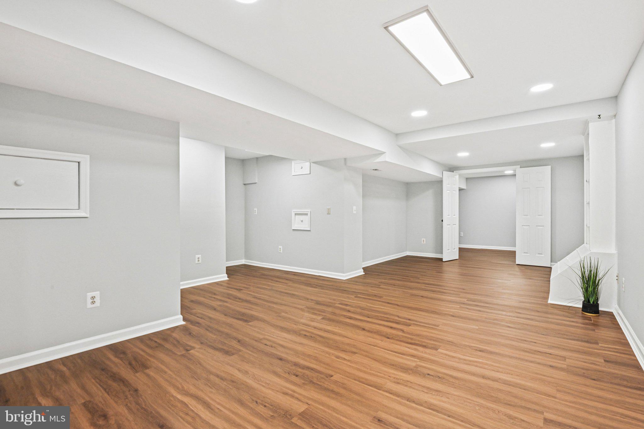 20733 Rainsboro Drive Ashburn, VA 20147 - Photo 48 of 63 a view of an empty room with wooden floor