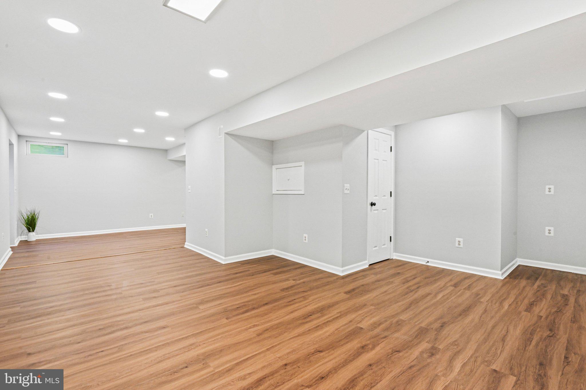 20733 Rainsboro Drive Ashburn, VA 20147 - Photo 49 of 63 a view of an empty room with wooden floor