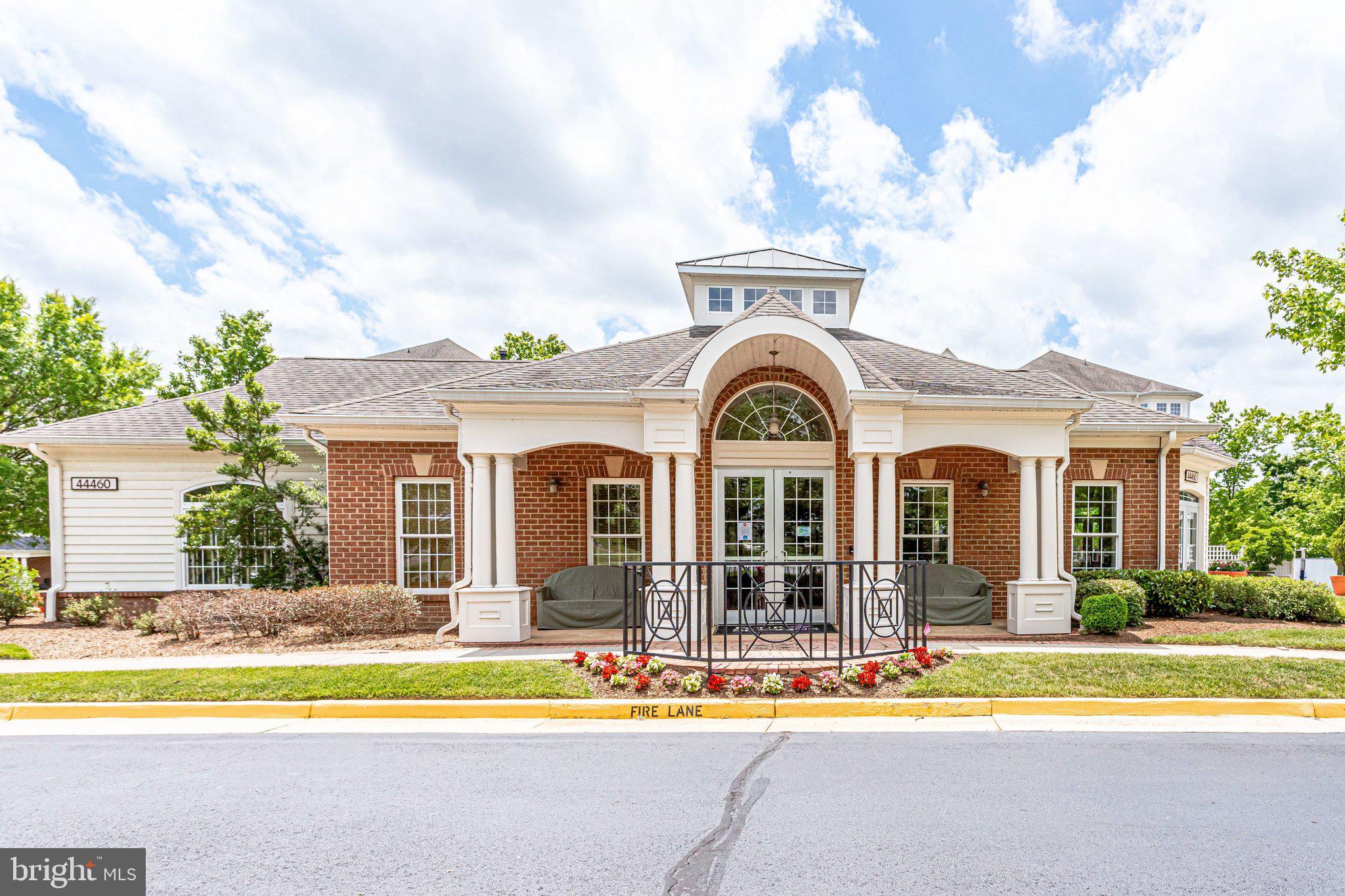 20733 Rainsboro Drive Ashburn, VA 20147 - Photo 59 of 63 a front view of a house with a swimming pool and outdoor seating