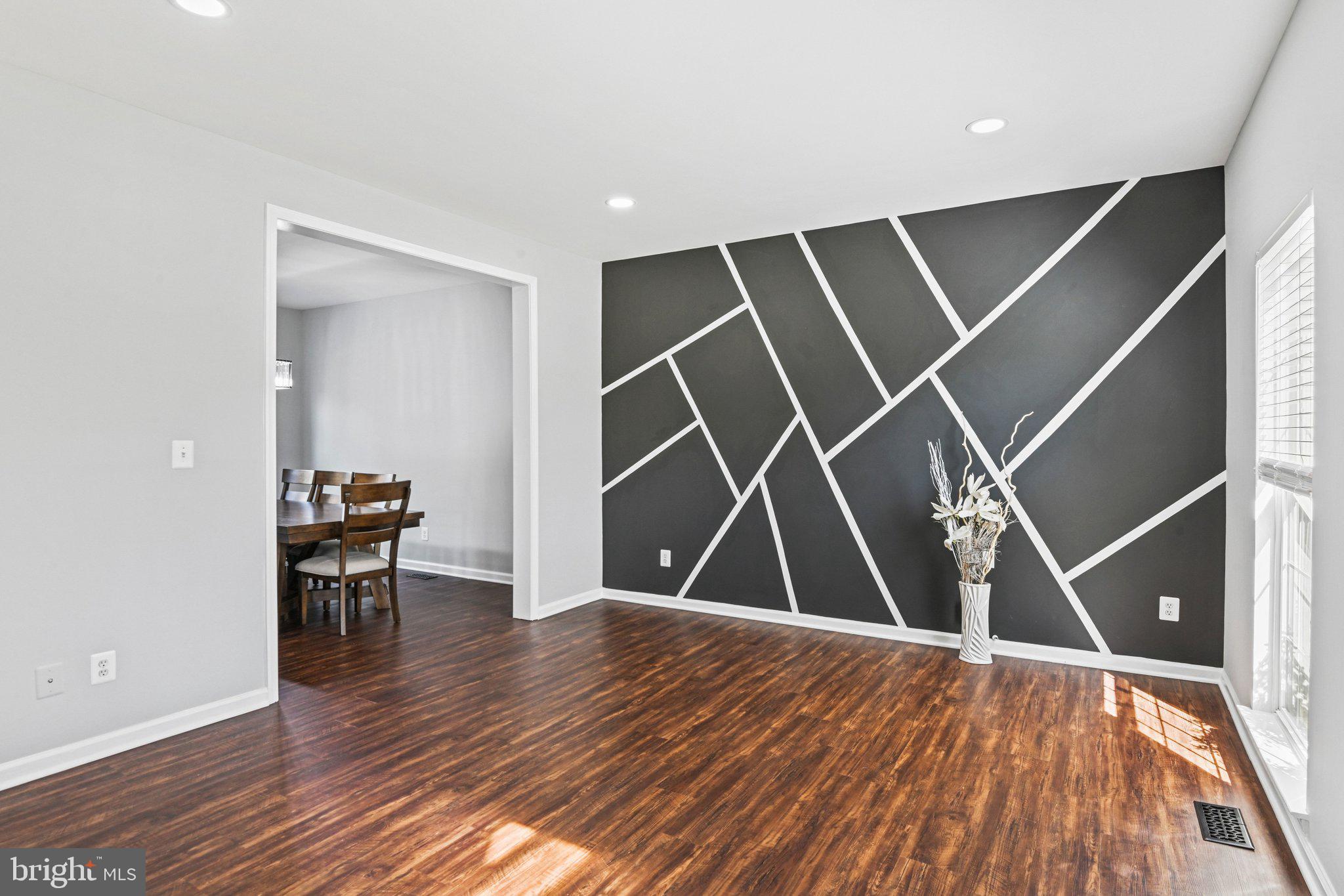 20733 Rainsboro Drive Ashburn, VA 20147 - Photo 8 of 63 a view of an empty room with wooden floor and a window