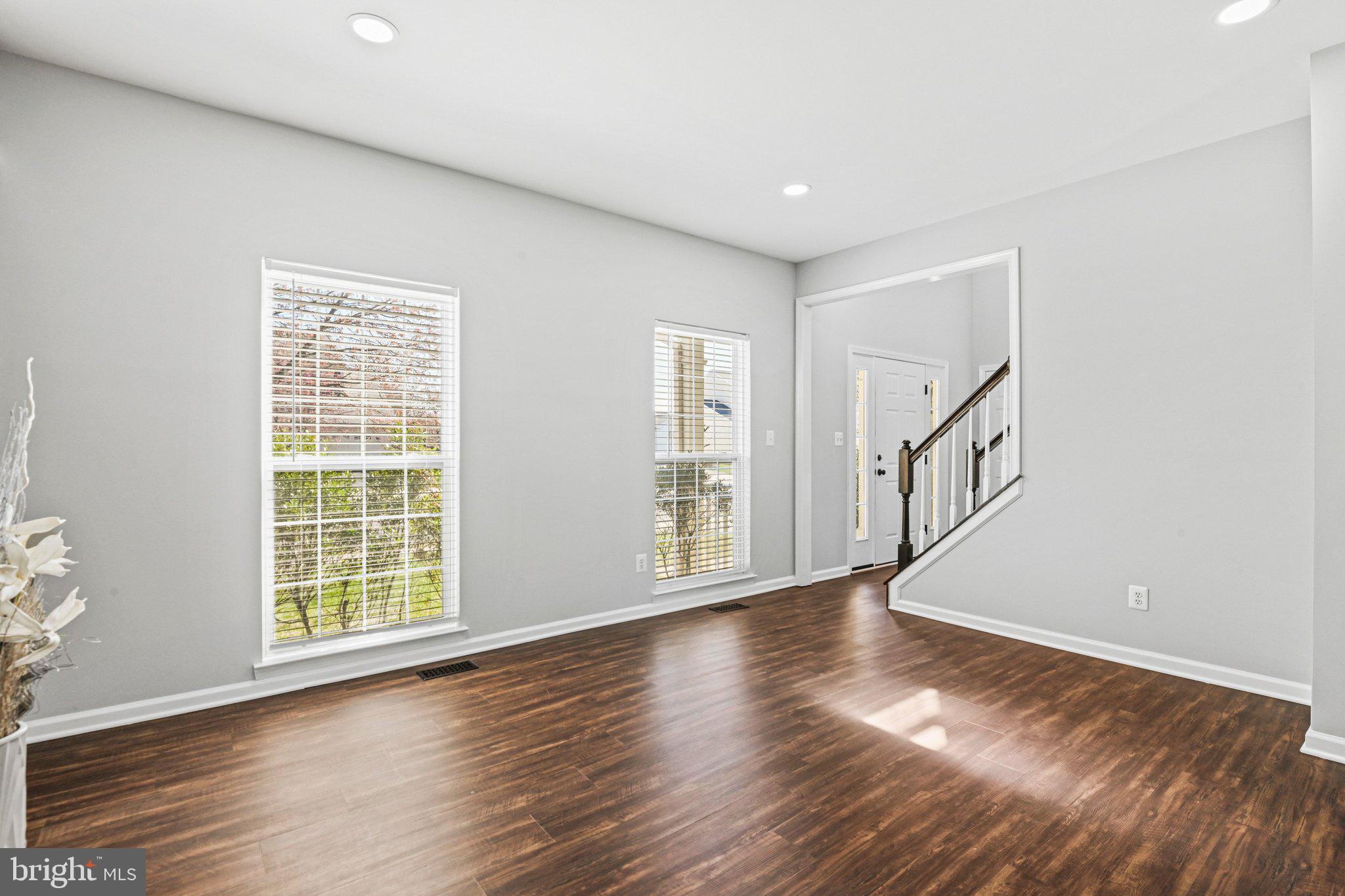 20733 Rainsboro Drive Ashburn, VA 20147 - Photo 9 of 63 a view of an empty room with wooden floor and a window