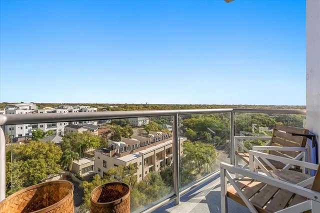 a view of a balcony with an ocean view