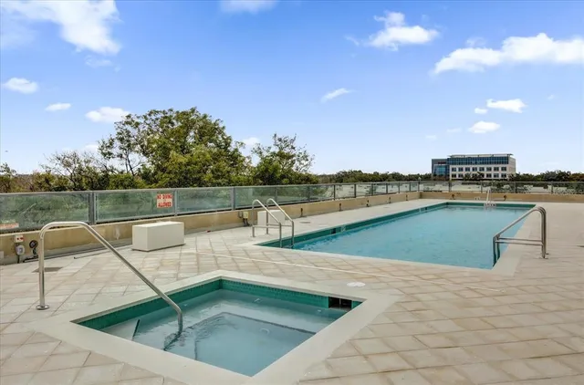 a view of a swimming pool with a lake