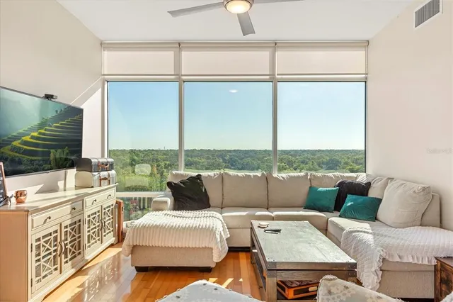 a living room with furniture and a large window