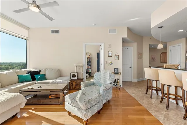 a living room with furniture and a view of living room