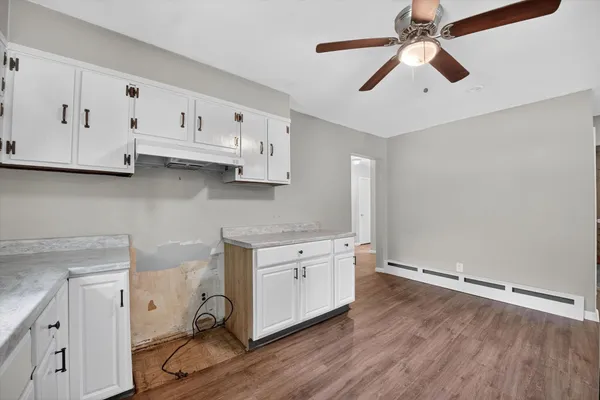 a view of cabinets and wooden floor