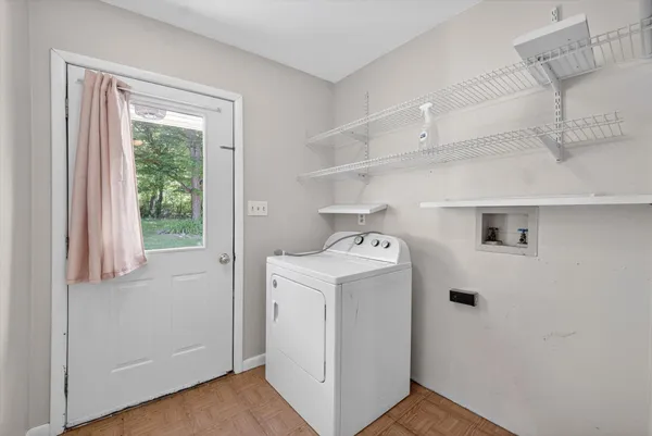 a view of storage and utility room with washer and dryer