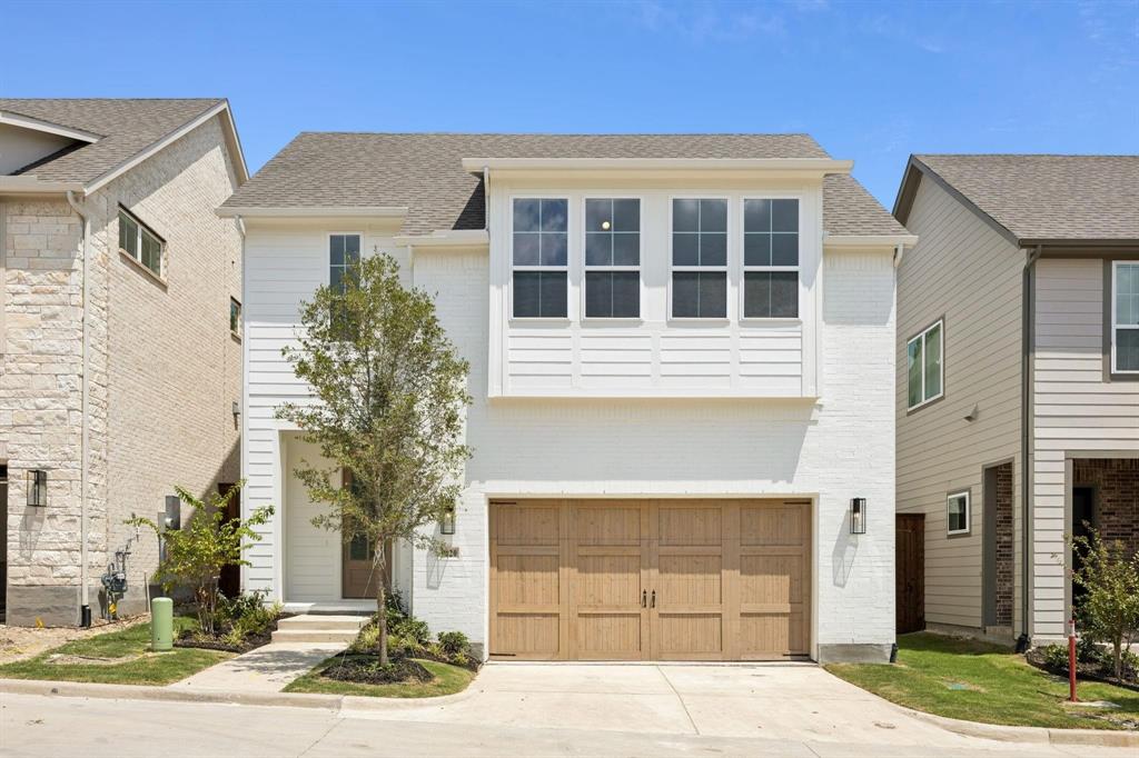 9620 Mav Lane Dallas, TX 75238 - Photo 1 of 11 View of front of property featuring brick siding, an attached garage, a shingled roof, and concrete driveway