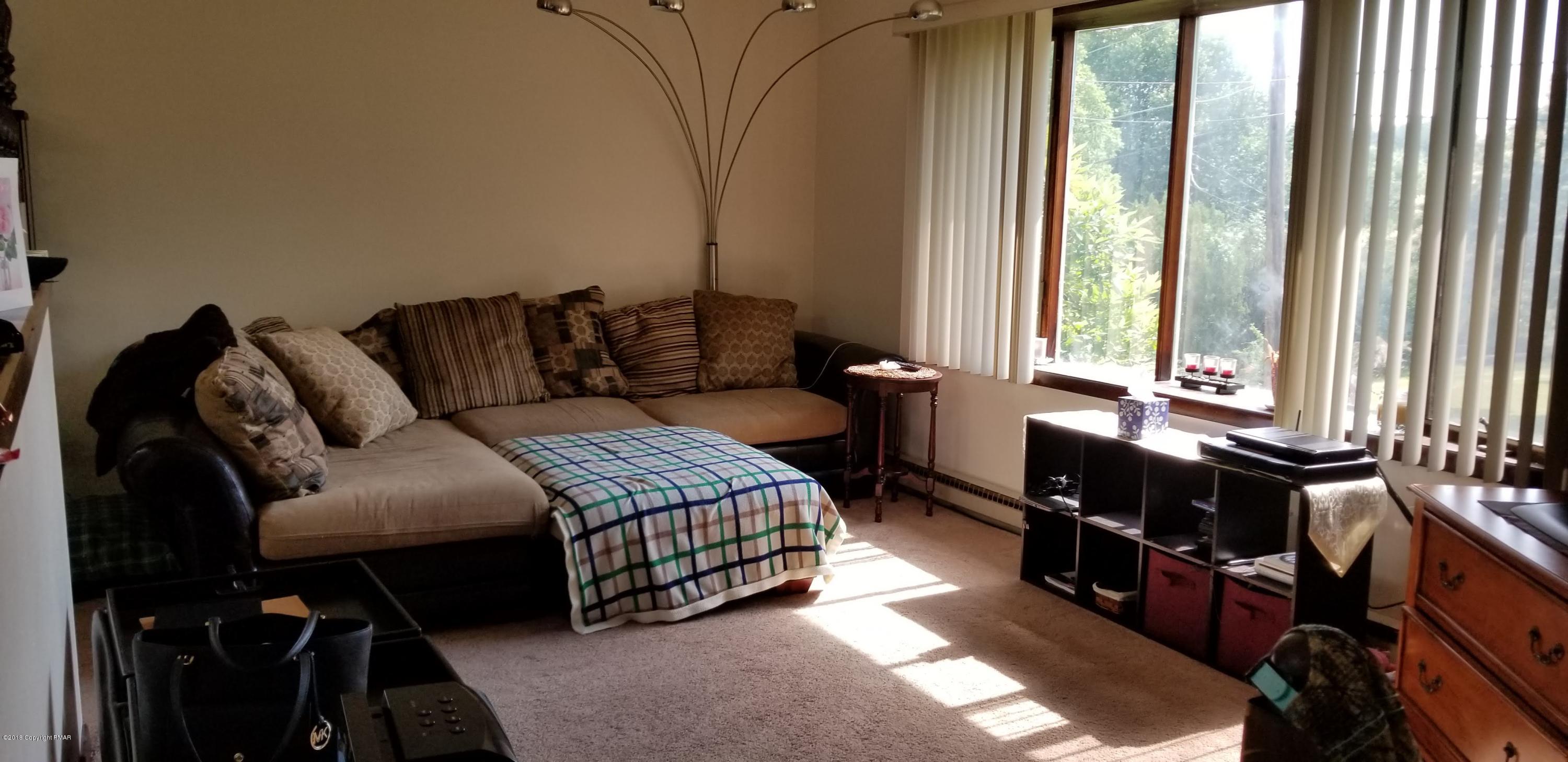 3401 Walnut Road Kunkletown, PA 18058 - Photo 14 of 25 a living room with furniture and large windows