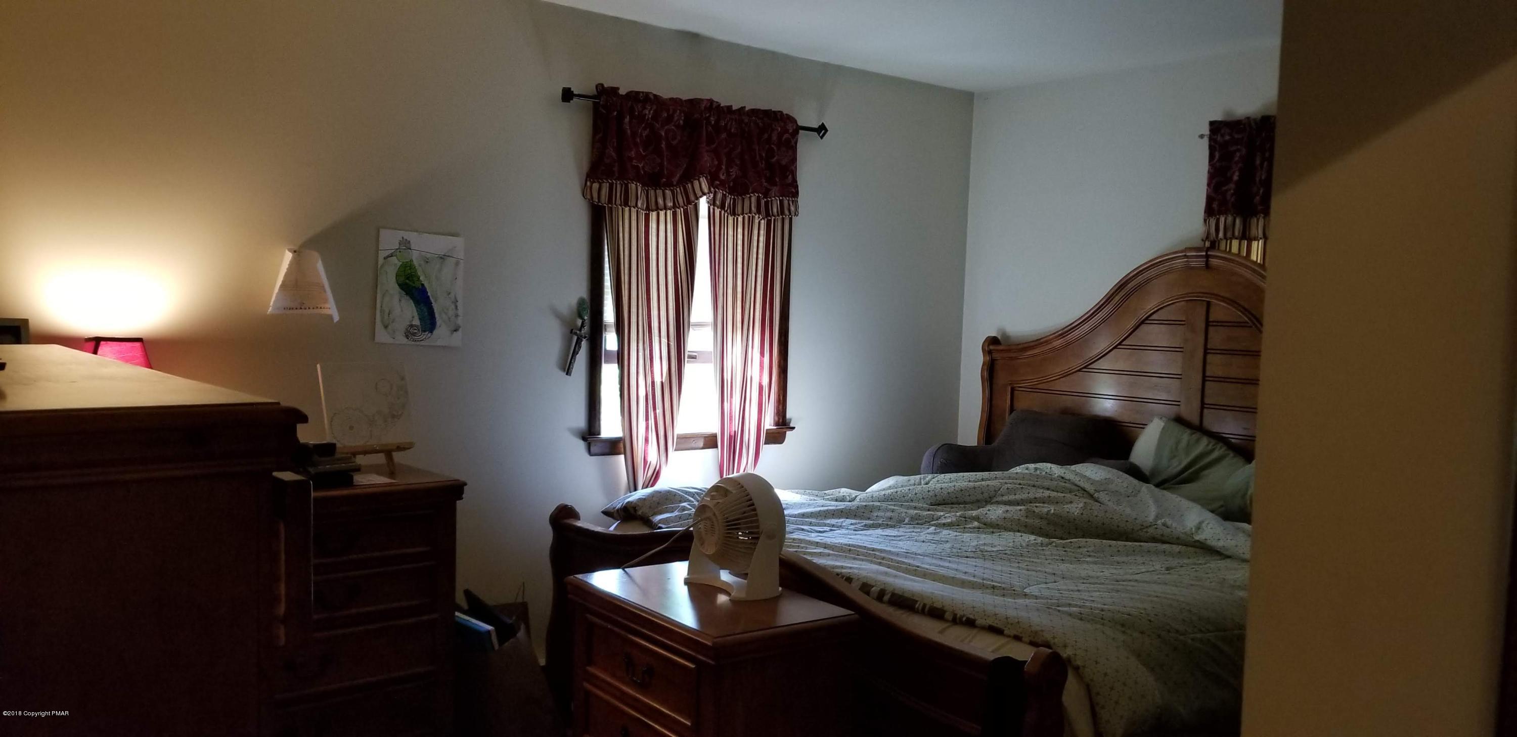 3401 Walnut Road Kunkletown, PA 18058 - Photo 16 of 25 a bedroom with a bed and a window