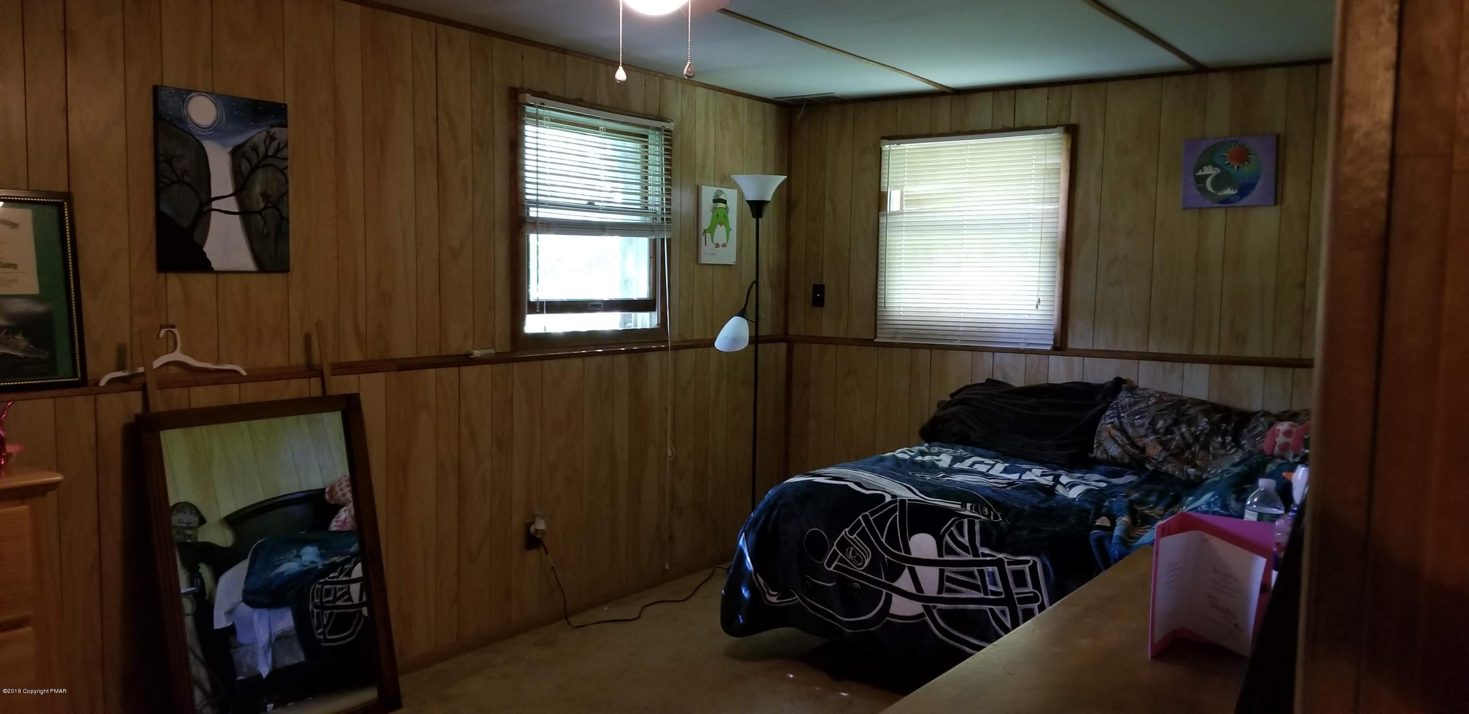 3401 Walnut Road Kunkletown, PA 18058 - Photo 19 of 25 a bedroom with a bed and a window