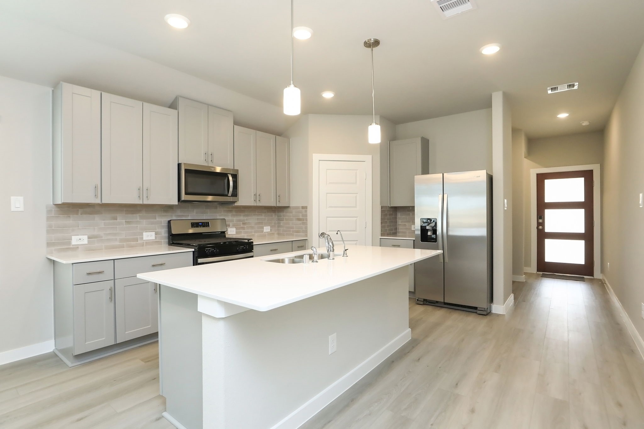 14110 Greystone Ter Street Magnolia, TX 77354 - Photo 6 of 34 Abundant Recessed Lighting Brightens The Kitchen Considerably. Note That The Breakfast Island Offers An Additional 3-4 Seats When Entertaining.