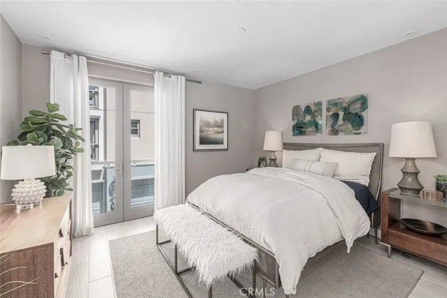 a bedroom with a bed and a lamp on table