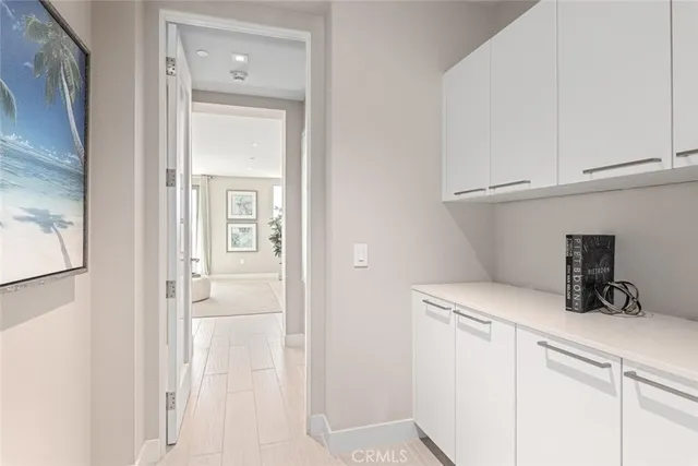 a view of a closet area with cabinets