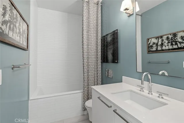 a bathroom with a sink a vanity and a mirror