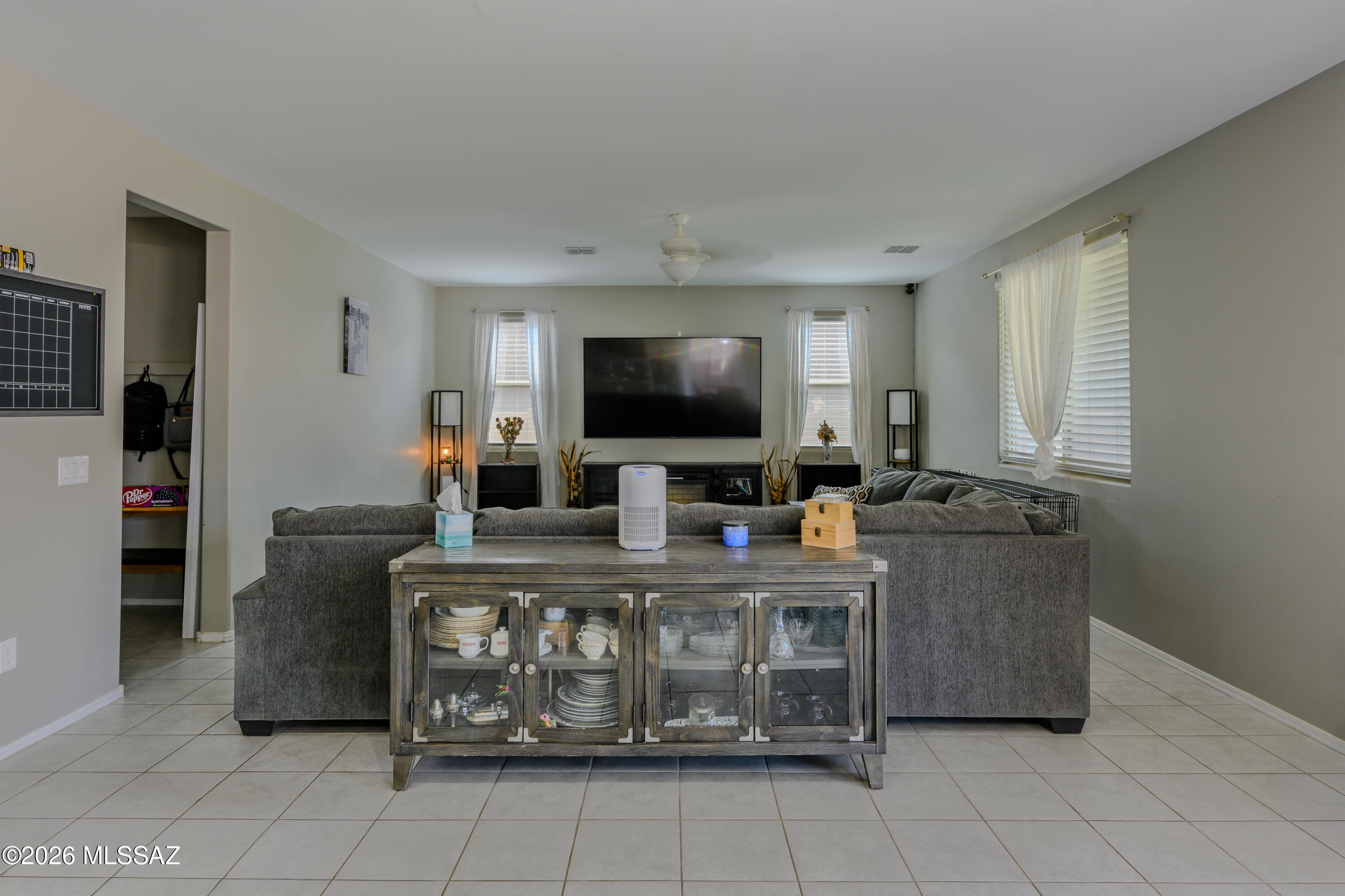 12093 East Ryscott Circle Vail, AZ 85641 - Photo 18 of 48 a living room with furniture and a flat screen tv