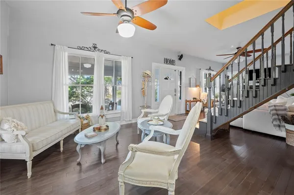a kitchen with stainless steel appliances granite countertop a stove refrigerator and a stove top oven