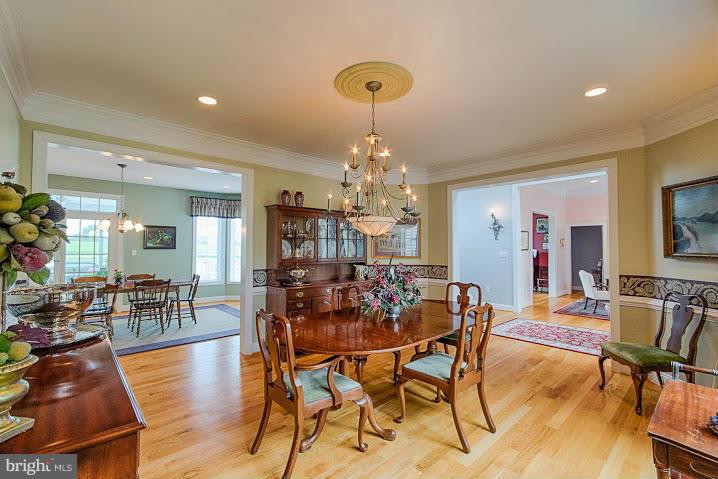1060 French Road Shenandoah Junction, WV 25442 - Photo 13 of 30 a view of a dining room with furniture wooden floor and chandelier