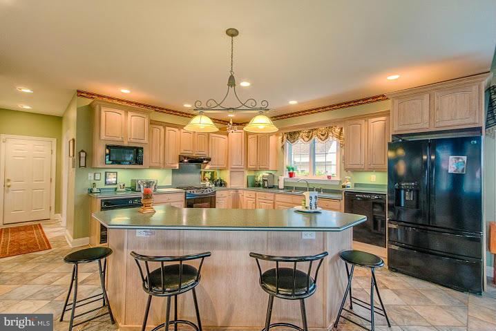 1060 French Road Shenandoah Junction, WV 25442 - Photo 15 of 30 a kitchen with stainless steel appliances granite countertop a table chairs and a refrigerator