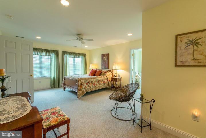 1060 French Road Shenandoah Junction, WV 25442 - Photo 23 of 30 a bedroom with a bed and a chandelier