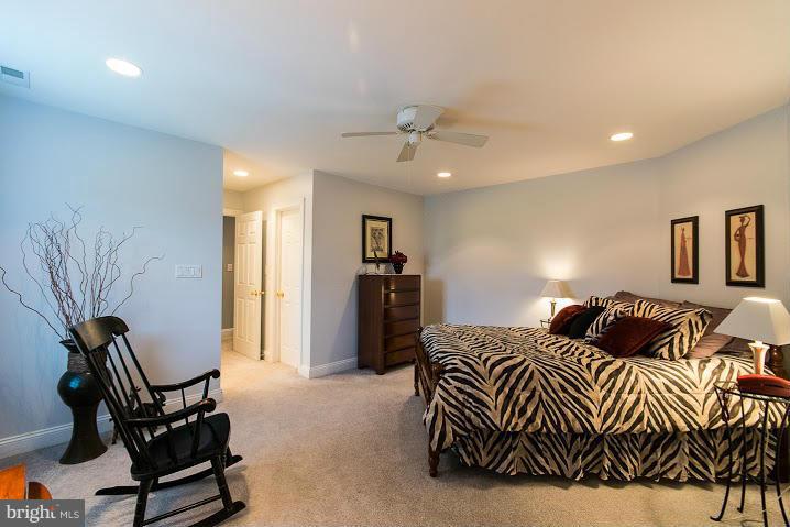 1060 French Road Shenandoah Junction, WV 25442 - Photo 25 of 30 a bedroom with a bed and a chandelier