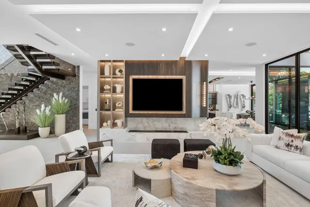 a large kitchen with granite countertop a large window and stainless steel appliances