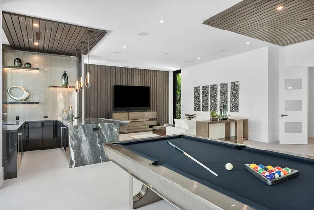 a bathroom with a tub shower and sink
