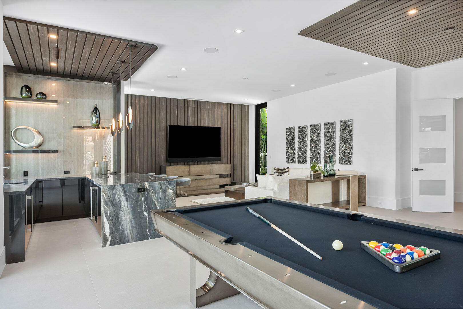 169 Coconut Palm Road Boca Raton, FL 33432 - Photo 32 of 84 a room with furniture and flat screen tv