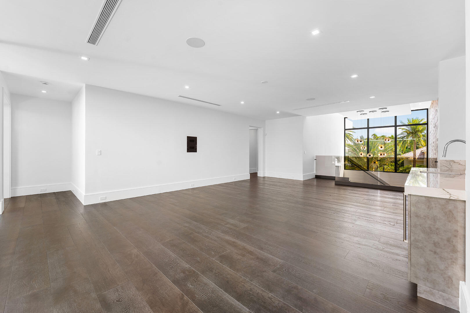 169 Coconut Palm Road Boca Raton, FL 33432 - Photo 37 of 84 an empty room with wooden floor and floor to ceiling window