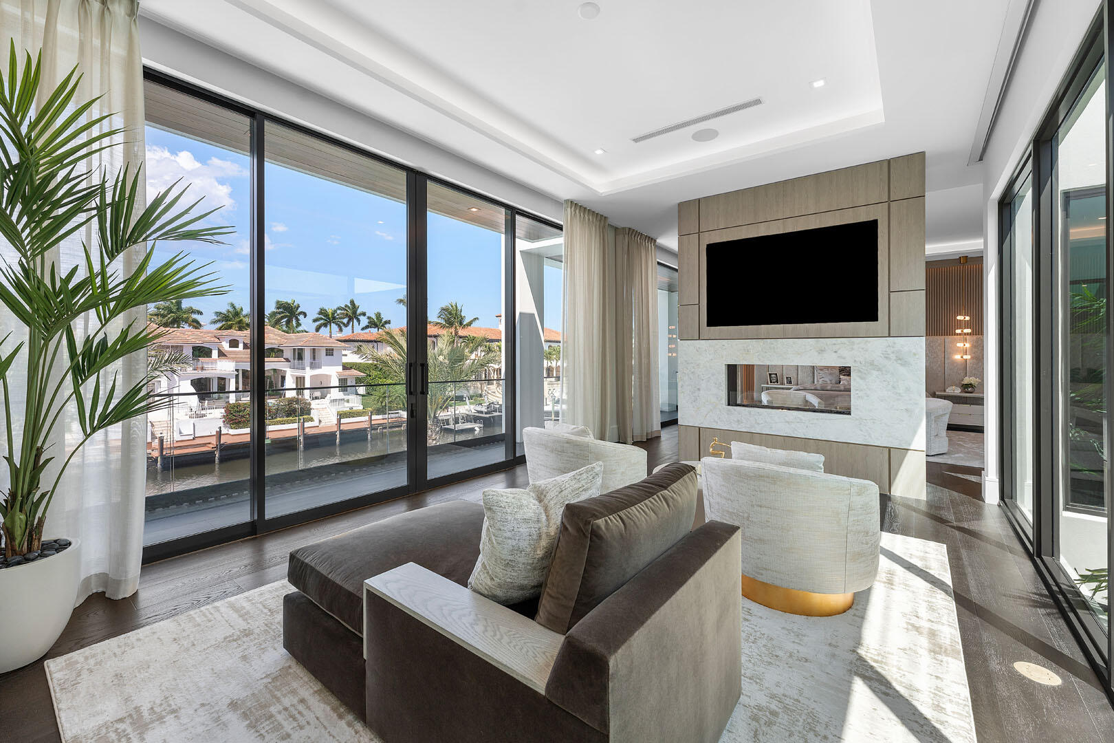 169 Coconut Palm Road Boca Raton, FL 33432 - Photo 42 of 84 a living room with furniture and a flat screen tv